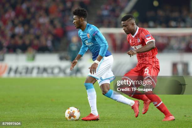 Ainsley Maitland-Niles of Arsenal and Jhon Cordoba of Cologne battle for the ball during the UEFA Europa League Group H soccer match between 1.FC...