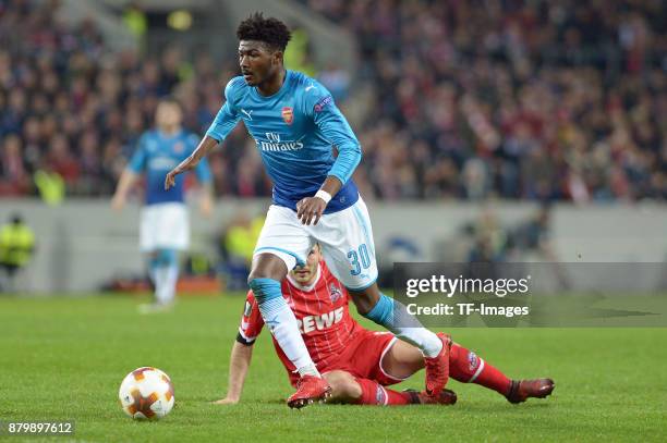 Ainsley Maitland-Niles of Arsenal and Milos Jojic of Cologne battle for the ball during the UEFA Europa League Group H soccer match between 1.FC...