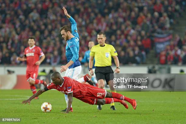 Sehrou Guirassy of Cologne and Calum Chambers of Arsenal battle for the ball during the UEFA Europa League Group H soccer match between 1.FC Cologne...