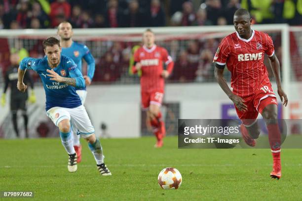 Mathieu Debuchy of Arsenal and Sehrou Guirassy of Cologne battle for the ball during the UEFA Europa League Group H soccer match between 1.FC Cologne...