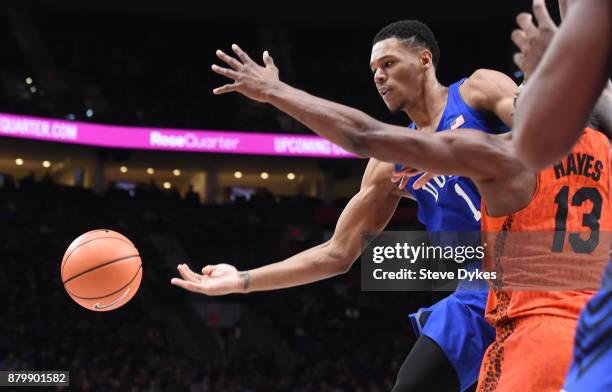 Trevon Duval of the Duke Blue Devils passes the ball as Kevarrius Hayes of the Florida Gators defends in the second half of the game during the...