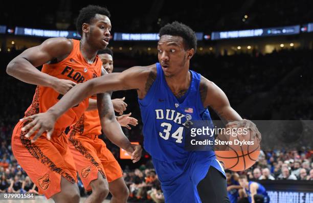 Wendell Carter Jr of the Duke Blue Devils drives to the basket on Keith Stone of the Florida Gators in the second half of the game during the...