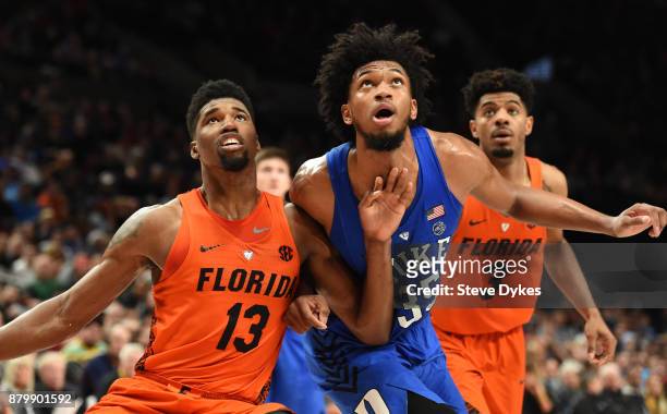 Kevarrius Hayes of the Florida Gators, Marvin Bagley III of the Duke Blue Devils and Jalen Hudson of the Florida Gators battle for position under the...