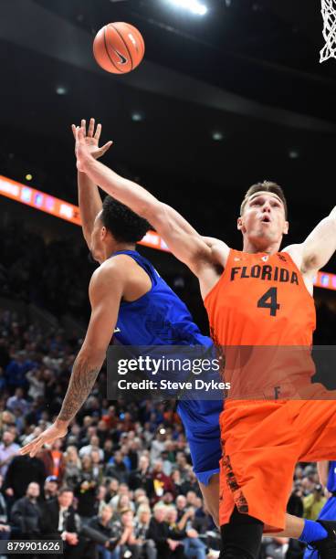 Gary Trent Jr of the Duke Blue Devils is fouled as he shoots the ball over Egor Koulechov of the Florida Gators in the second half of the game during...