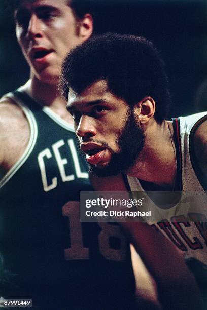 Kareem Abdul-Jabbar of the Milwaukee Bucks and Dave Cowens of the Boston Celtics look on during a game played in 1974 at the Boston Garden in Boston,...