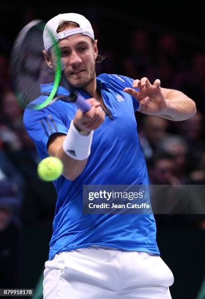 Lucas Pouille of France in action against Steve Darcis of Belgium during day 3 of the Davis Cup World Group final between France and Belgium at Stade...
