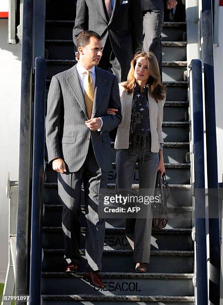 Spain's Crown Prince Felipe de Borbon and his wife princess Letizia Ortiz get down from the plane upon arrival at the CATAM military base in Bogota,...