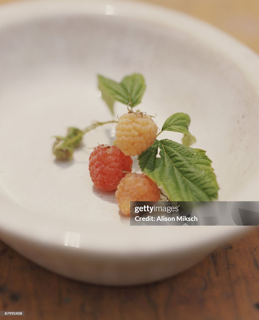 Golden raspberries in bowl