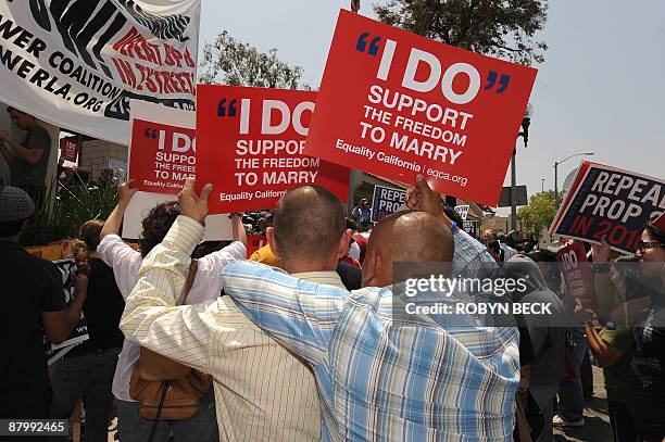 Eric Manriquez and his partner Juan Rivera attend a protest rally outside the Los Angeles County Marriage License Office in Los Angeles, California...