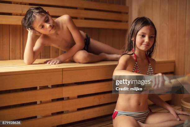 children in spa center - young boy in sauna stock pictures, royalty-free photos & images