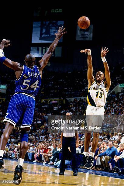 Mark Jackson of the Indiana Pacers shoots a jump shot against Horace Grant of the Orlando Magic in Game Four of the Eastern Conference Finals during...