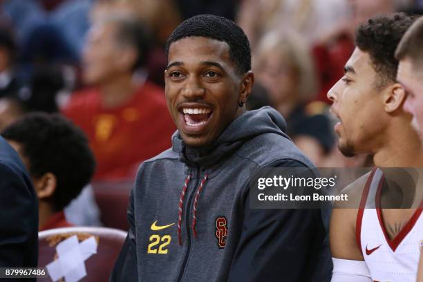 De'Anthony Melton of the USC Trojans cheers on his team from the bench against the Texas A&M Aggies during a college basketball game at Galen Center...