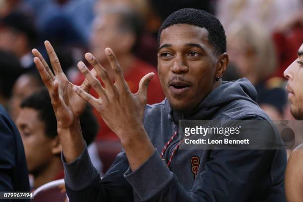 De'Anthony Melton of the USC Trojans cheers on his team from the bench against the Texas A&M Aggies during a college basketball game at Galen Center...
