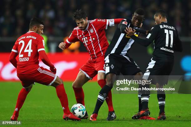 Javi Martinez of Bayern Munich battles for the ball with Denis Zakaria of Borussia Monchengladbach during the Bundesliga match between Borussia...