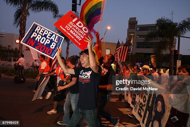 Thousands of supporters of same-sex marriage march from West Hollywood to Hollywood following the California Supreme Court ruling to uphold...