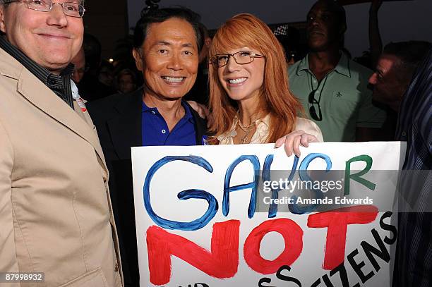 Comedienne Kathy Griffin and actor George Takei and his husband Brad Altman attend the Prop 8 Rally on May 26, 2009 in West Hollywood, California.