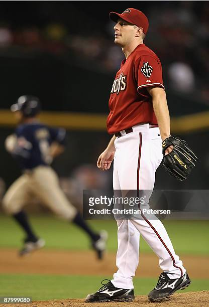 Starting pitcher Max Scherzer of the Arizona Diamondbacks reacts after giving up a solo home run to Chris Burke of the San Diego Padres during the...