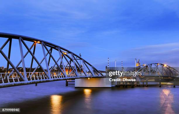 mr.j.j. van de veldebrug bridge at twilight, amsterdam - amsterdam business stock pictures, royalty-free photos & images