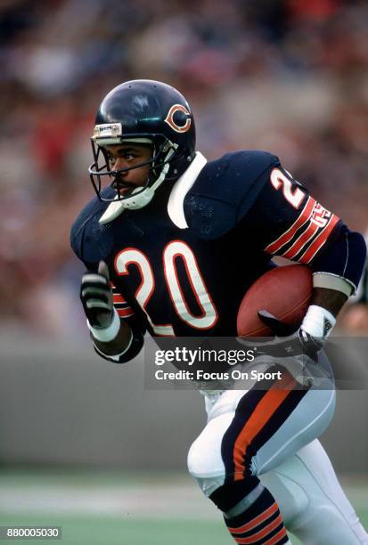 Thomas Sanders of the Chicago Bears carries the ball during an NFL football game circa 1988 at Soldier Field in Chicago, Illinois. Sanders played for...