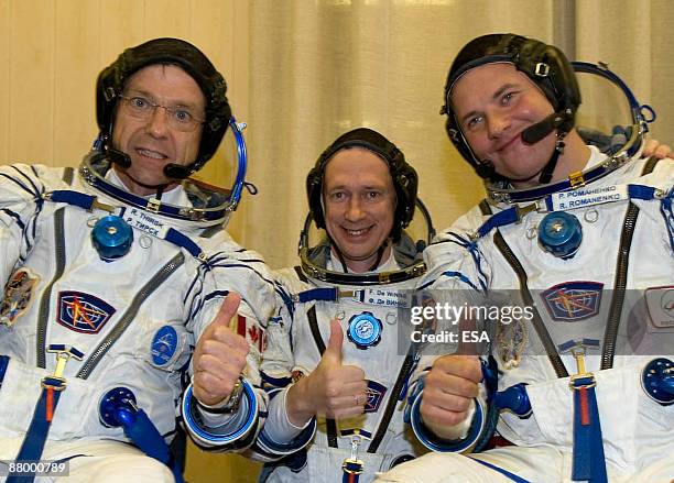 In this handout photo provided by the European Space Agency , The Soyuz TMA-15 crew of Canadian Space Agency astronaut Robert Thirsk , Russian...