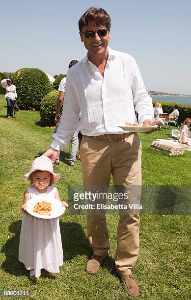 Alessio Vinci and his daughter attend a picnic brunch at La Posta Vecchia on May 24, 2009 in Ladispoli, Italy.