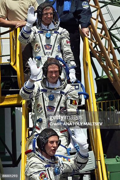 The members of the main international space crew, Canadian astronaut Robert Thirsk , European Space Agency astronaut Frank De Winne of Belgium and...