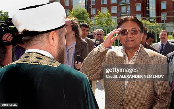 Former Pakistani president Pervez Musharraf salutes while visiting a Muslim cultural center in Moscow on May 27, 2009. Russian gas export monopoly...