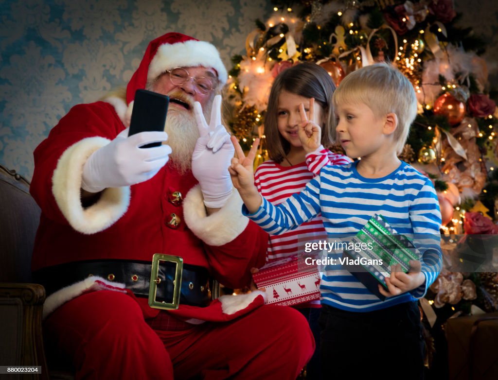 Kids and Santa using digital tablets