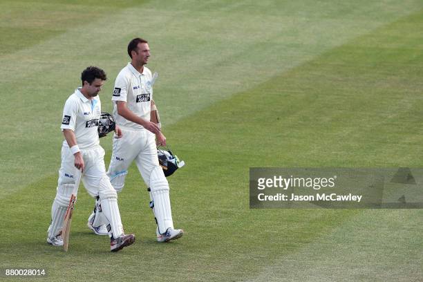 Ed Cowan and Trent Copeland of NSW leave the field during day four of the Sheffield Shield match between New South Wales and Victoria at North Sydney...