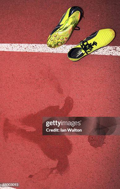 The imprint of the sweat of Usain Bolt of Jamaica remains on the track next to a pair of his running spikes following a training session at the...
