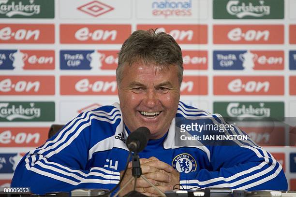 Chelsea's Dutch manager Guus Hiddink answers questions during a press conference at their training grounds in Cobham, Surrey, on May 27, 2009....