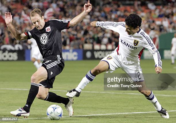 Bryan Namoff of D.C. United is challenged by Tony Beltran of Real Salt Lake during an MLS match at RFK Stadium on May 23, 2009 in Washington, DC. The...