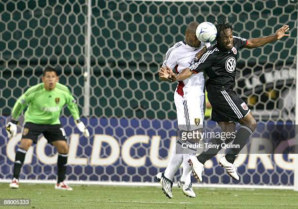 Luciano Emilio of D.C. United is pushed in the back by Robbie Russell of Real Salt Lake during an MLS match at RFK Stadium on May 23, 2009 in...