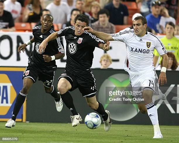 Marc Burch of D.C. United closes in on Yura Movsisyan of Real Salt Lake during an MLS match at RFK Stadium on May 23, 2009 in Washington, DC. The...