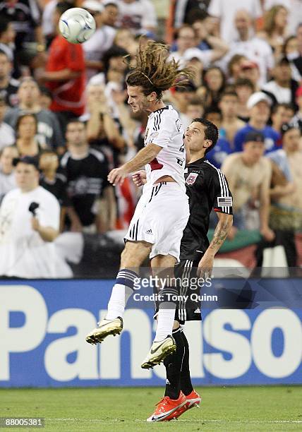 Santino Quaranta of D.C. United watches Kyle Beckerman of Real Salt Lake go up for a header during an MLS match at RFK Stadium on May 23, 2009 in...