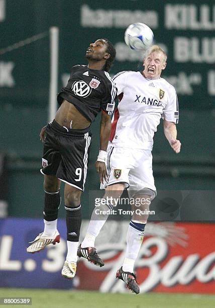 Ange N'Silu of D.C. United heads the ball back towards Nat Borchers of Real Salt Lake during an MLS match at RFK Stadium on May 23, 2009 in...
