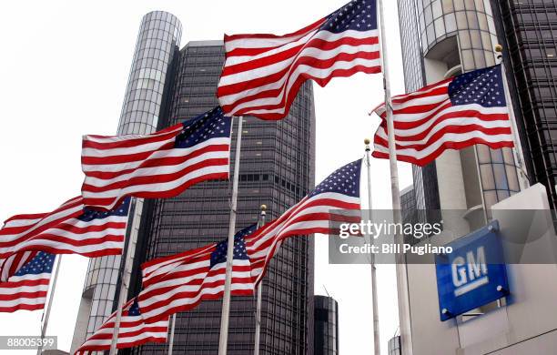 Flags fly outside the General Motors world headquarters building May 27, 2009 in Detroit, Michigan. GM announced today that it failed trying to trade...