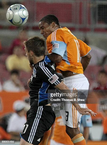 Ricardo Clark of the Houston Dynamo heads the ball over Bobby Convey of the San Jose Earthquakes at Robertson Stadium on May 23, 2009 in Houston,...