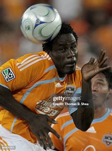 Ade Akinbiyi of the Houston Dynamo heads the ball away from the San Jose Earthquakes at Robertson Stadium on May 23, 2009 in Houston, Texas.