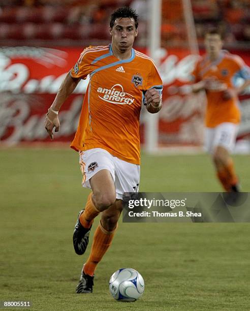 Geoff Cameron of the Houston Dynamo dribbles the ball against the San Jose Earthquakes at Robertson Stadium on May 23, 2009 in Houston, Texas.