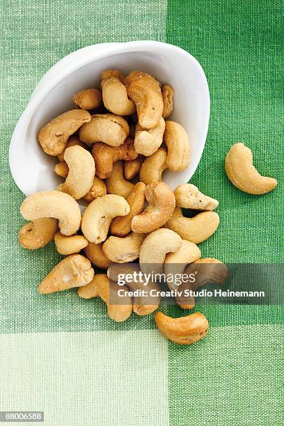 cashews in bowl, elevated view - cashews stock pictures, royalty-free photos & images