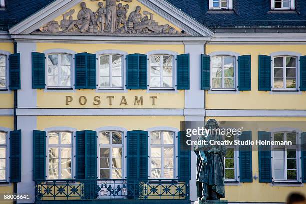 germany, bonn, beethoven monument with post office in background - bonn foto e immagini stock