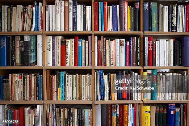 various books on shelves, full frame - book shelf stock pictures, royalty-free photos & images