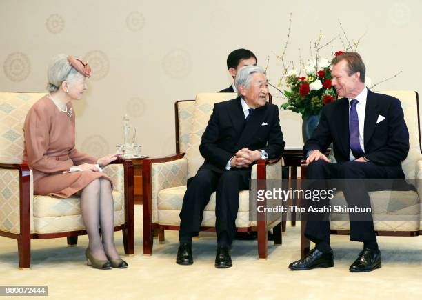 Grand Duke Henri of Luxembourg talks with Emperor Akihito and Empress Michiko during their meeting at the Imperial Palace on November 27, 2017 in...