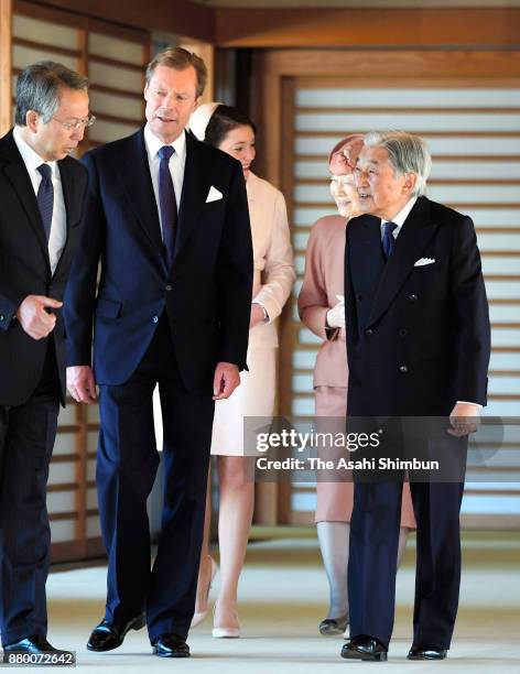 Grand Duke Henri of Luxembourg and his daughter Princess Alexandra of Luxembourg walk a corridor with Emperor Akihito and Empress Michiko prior to...