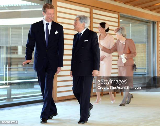 Grand Duke Henri of Luxembourg and his daughter Princess Alexandra of Luxembourg walk a corridor with Emperor Akihito and Empress Michiko prior to...