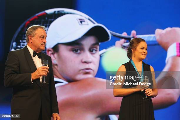 John Newcombe medallist Ashleigh Barty stands on the podium with John Newcombe at the 2017 Newcombe Medal at Crown Palladium on November 27, 2017 in...