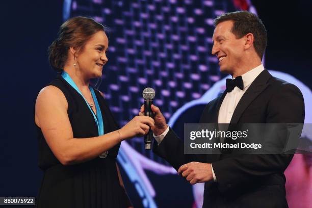 John Newcombe medallist Ashleigh Barty with host Rove McManus at the 2017 Newcombe Medal at Crown Palladium on November 27, 2017 in Melbourne,...