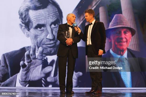 Former Premier of Victoria John Cain speaks with former tennis player Todd Woodbridge on stage at the 2017 Newcombe Medal at Crown Palladium on...