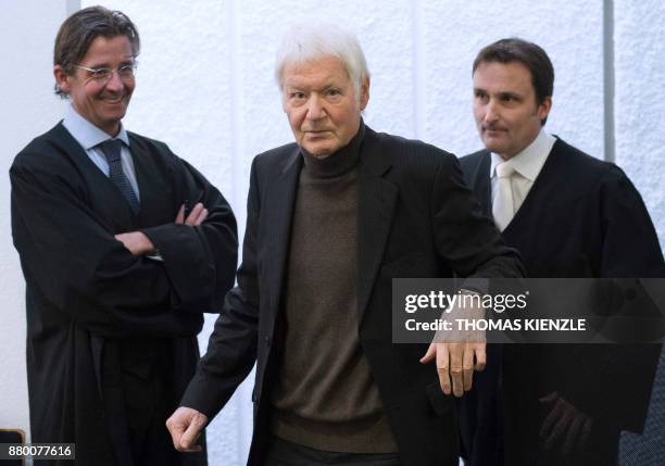 Anton Schlecker , founder of German drugstore chain Schlecker, and his lawyer Norbert Scharf arrive in the district court in Stuttgart, southwestern...